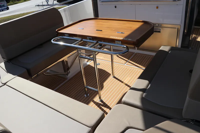 Slide: The Image of 2025 Nimbus T11 boat interior with sleek design and Simrad navigation system. - 17