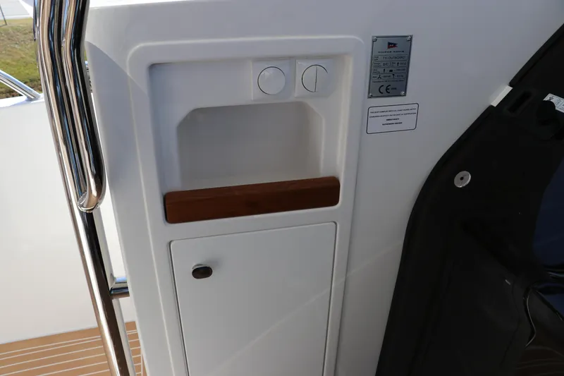 Slide: The Image of Control panel of 2025 Nimbus T11 with engine start and trim buttons. - 31