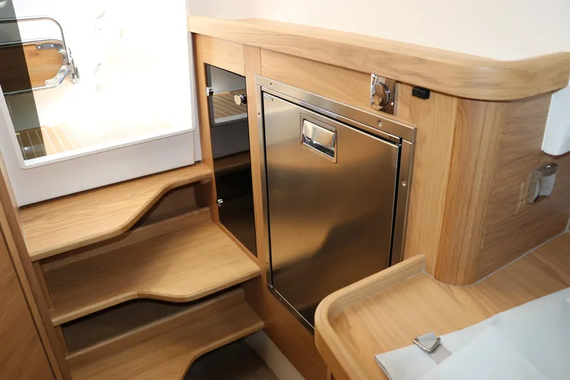 Slide: The Image of Luxurious interior cabin of 2025 Nimbus T11 boat with cozy seating and cushions. - 41