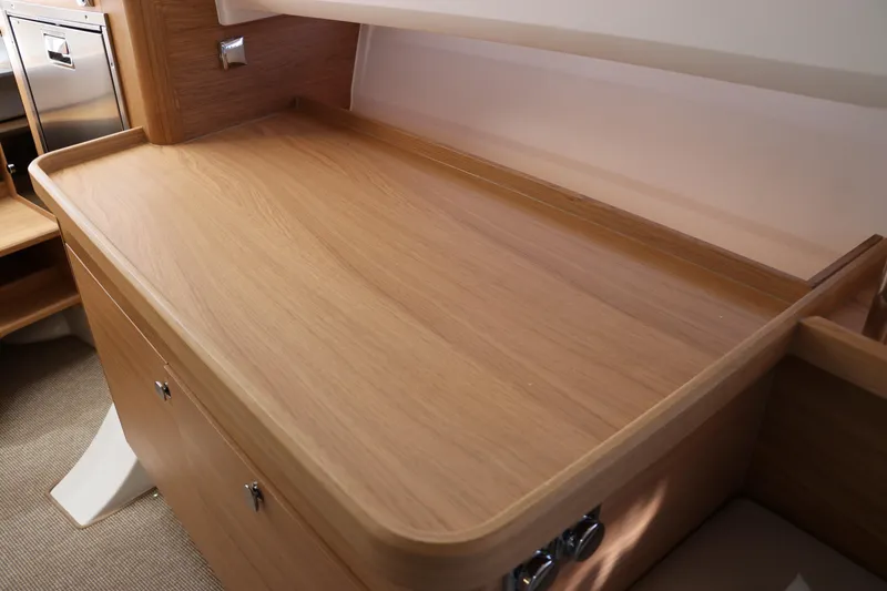 Slide: The Image of Cozy interior cabin of 2025 Nimbus T11 with cushions and wooden accents. - 44