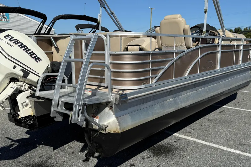 Slide: The Image of 2013 Bennington 2275 GFS pontoon boat with Evinrude engine in parking lot. - 8