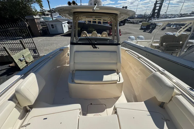 Slide: The Image of 2022 Grady-White Canyon 326 boat interior with seating and helm station. - 28