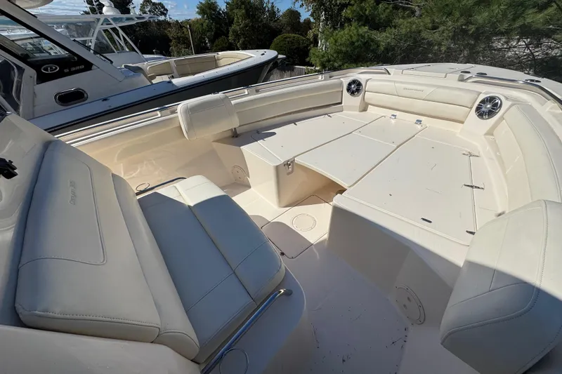 Slide: The Image of 2022 Grady-White Canyon 326 boat interior with spacious seating and modern design. - 29