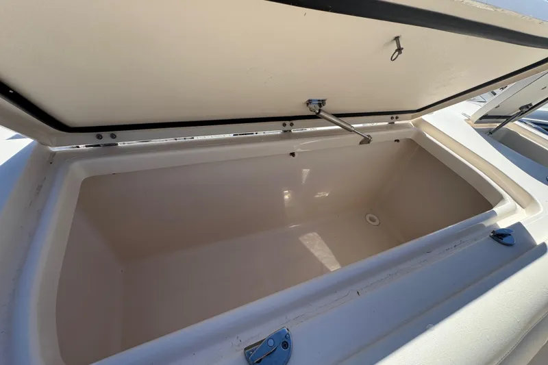 Slide: The Image of Open storage compartment on 2022 Grady-White Canyon 326 boat. - 36