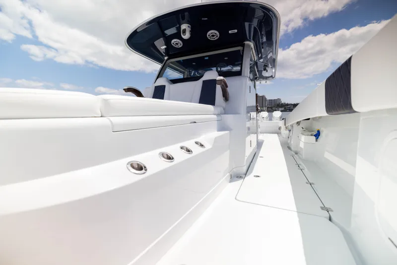 Slide: The Image of 2026 Freeman 47 LX boat interior with sleek white design and modern features. - 12