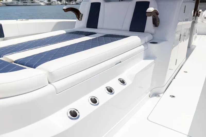 Slide: The Image of Luxurious seating on 2026 Freeman 47 LX boat with blue and white upholstery. - 13