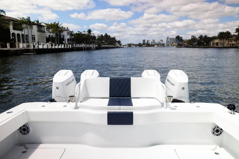 Slide: The Image of Freeman 47 LX 2026 boat with Mercury engines on a scenic waterway. - 18