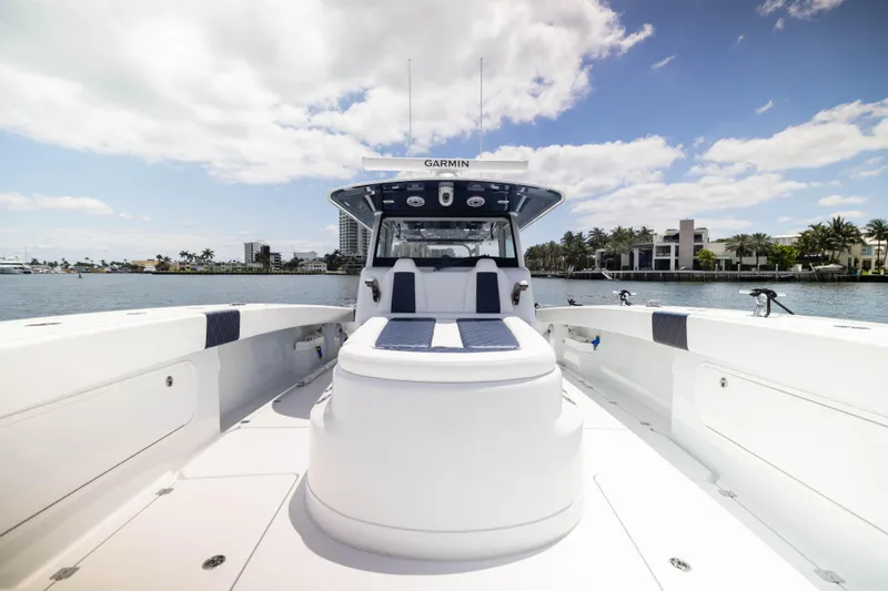 Slide: The Image of 2026 Freeman 47 LX boat on water, clear sky, luxury waterfront homes in background. - 4