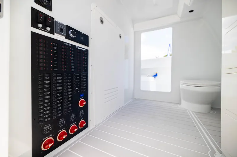 Slide: The Image of Freeman 47 LX 2026 boat interior with control panel and toilet. - 21