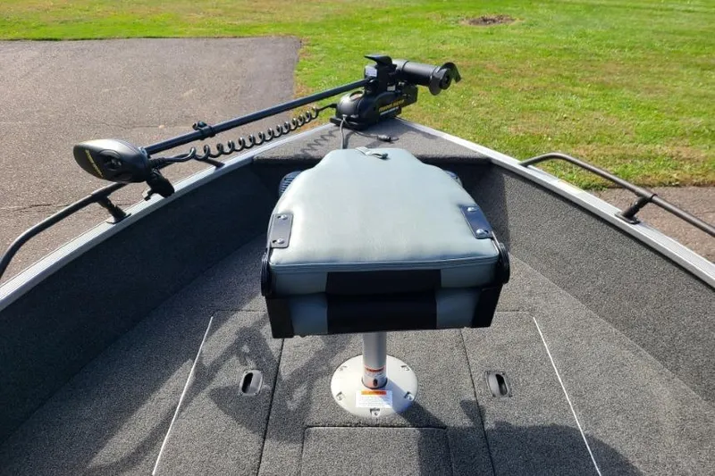 Slide: The Image of 2016 Lowe Fishing Machine 165SC Pro boat with trolling motor and cushioned seat. - 13