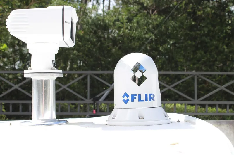 Slide: The Image of FLIR camera system on 2008 Contender 38 Express boat, outdoor setting. - 13
