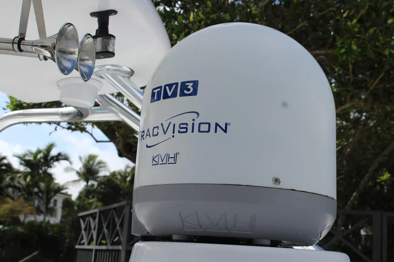 Slide: The Image of KVH TracVision TV3 satellite dome on 2008 Contender 38 Express boat. - 14