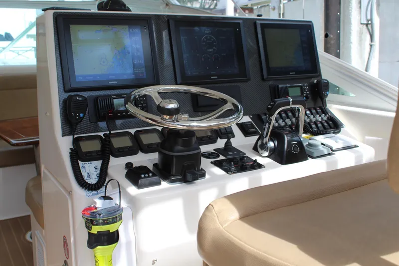Slide: The Image of 2008 Contender 38 Express helm with advanced navigation and control systems. - 15