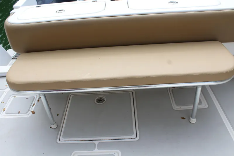 Slide: The Image of 2008 Contender 38 Express boat seating area with storage compartments. - 25