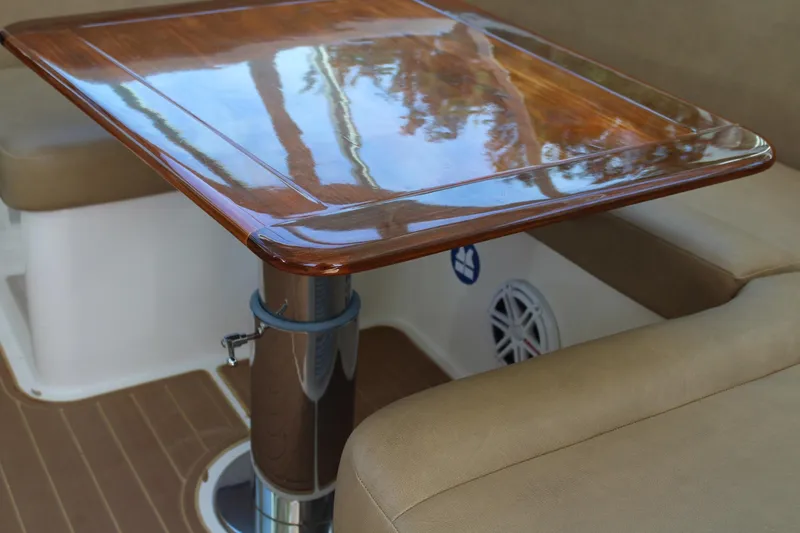 Slide: The Image of Luxurious wooden table on 2008 Contender 38 Express boat, surrounded by cushioned seating. - 33