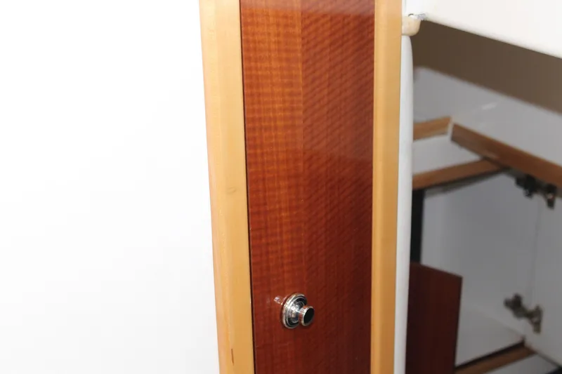 Slide: The Image of Wooden cabinet detail on 2008 Contender 38 Express boat interior. - 45