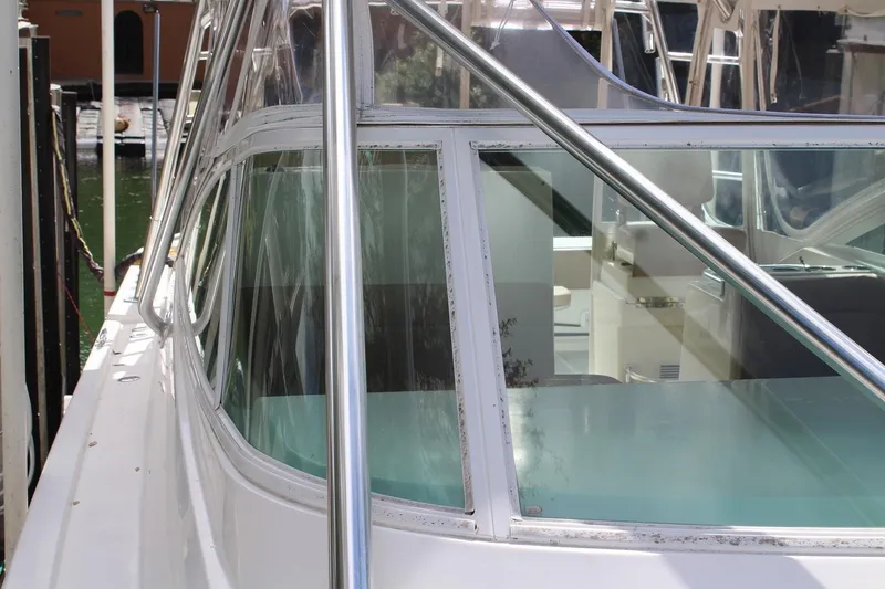 Slide: The Image of 2008 Contender 38 Express boat with sleek design and clear windows. - 5