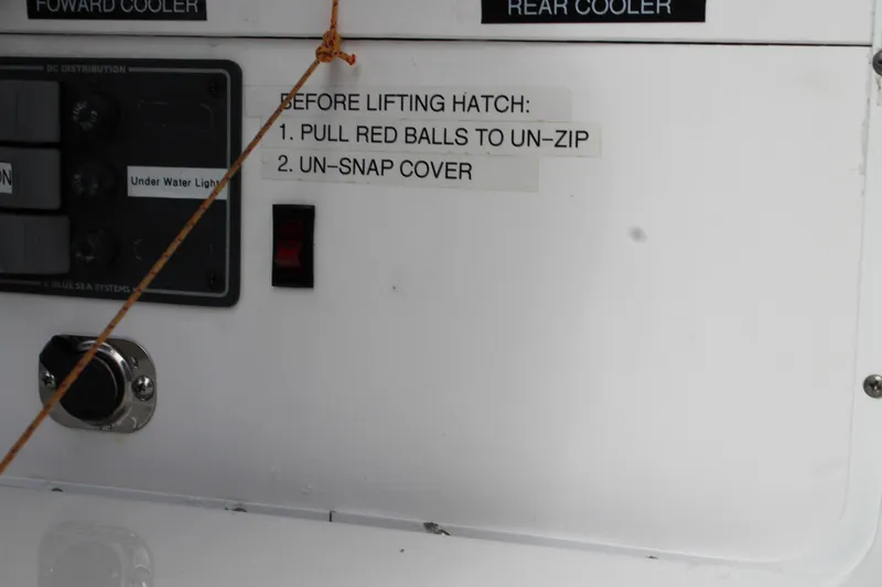 Slide: The Image of Control panel on a 2008 Contender 38 Express boat with hatch instructions. - 53