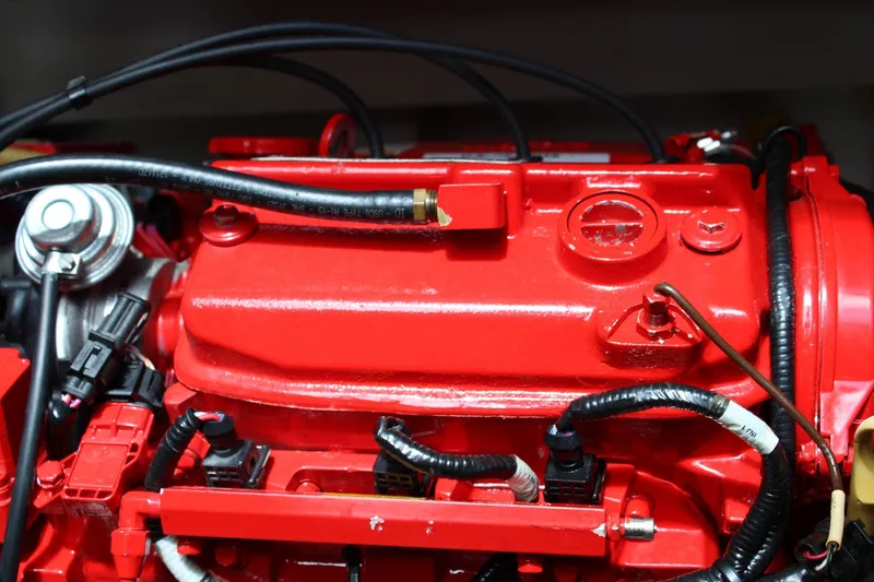 Slide: The Image of Red engine of 2008 Contender 38 Express boat, featuring detailed wiring and components. - 56