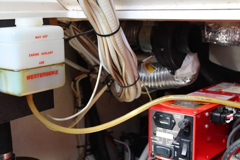 Slide: The Image of Engine compartment of 2008 Contender 38 Express with Westerbeke coolant system. - 57