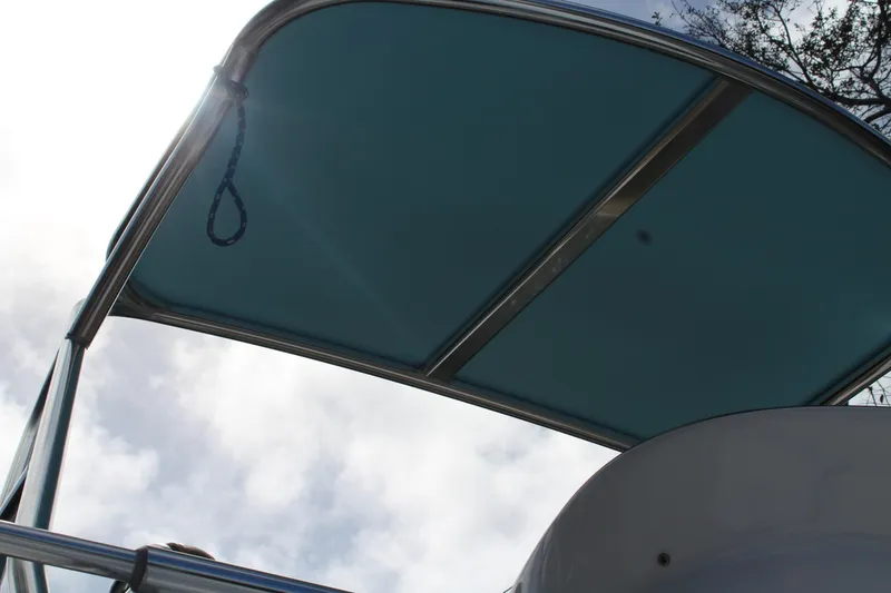 Slide: The Image of 2008 Contender 38 Express boat canopy against a cloudy sky. - 58