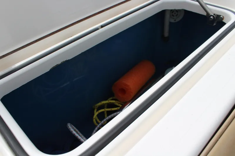 Slide: The Image of Storage compartment on 2008 Contender 38 Express boat with ropes and an orange float. - 63