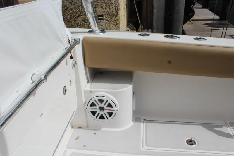 Slide: The Image of 2008 Contender 38 Express boat interior with speaker and cushioned seating. - 64