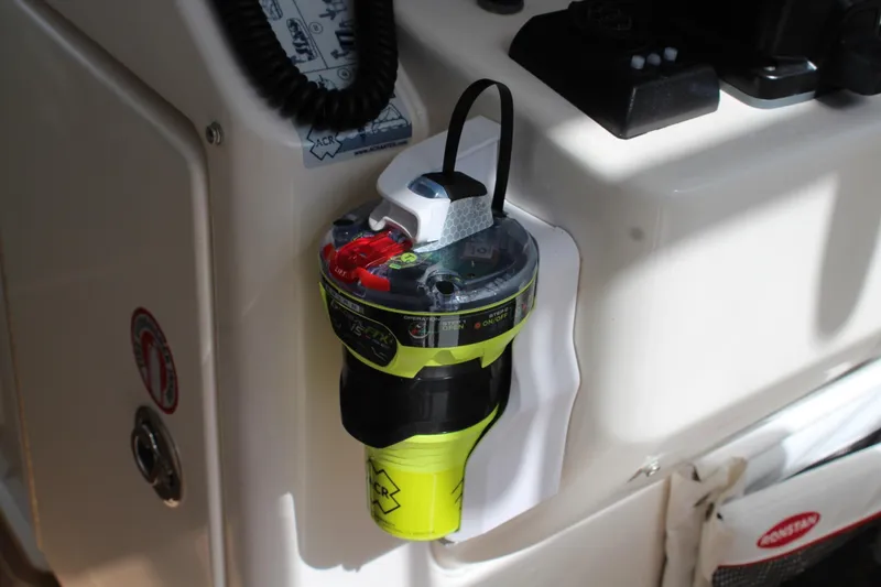 Slide: The Image of Safety equipment mounted on a 2008 Contender 38 Express boat dashboard. - 65
