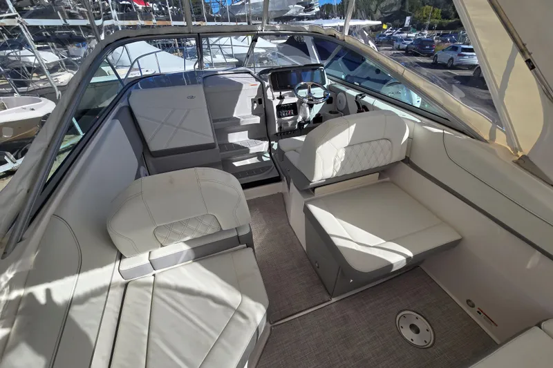 Slide: The Image of 2026 Regal 26 XO boat interior with white seating and modern dashboard. - 3