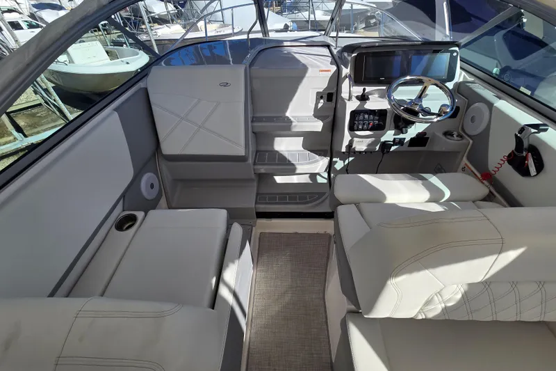 Slide: The Image of Interior of 2026 Regal 26 XO boat with modern helm and seating. - 5