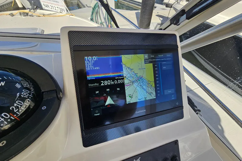Slide: The Image of Garmin navigation display on 2006 Carolina Classic 25 Express boat dashboard. - 12