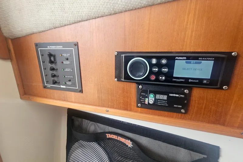 Slide: The Image of 2006 Carolina Classic 25 Express interior with control panel and audio system. - 20