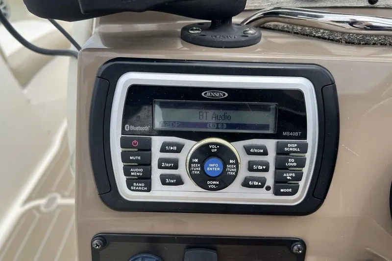 Slide: The Image of Jensen MS40BT audio system on 2015 Stingray 234LR boat dashboard. - 18