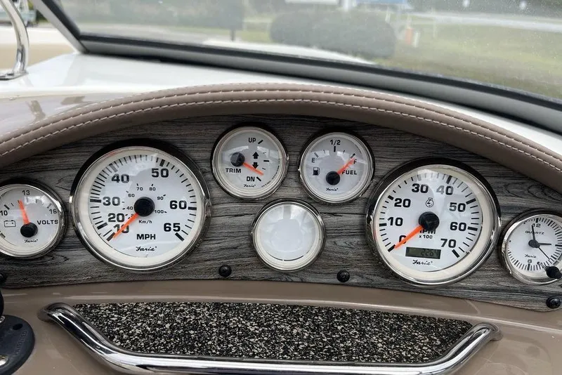 Slide: The Image of Dashboard of a 2015 Stingray 234LR boat with speedometer and fuel gauges. - 21