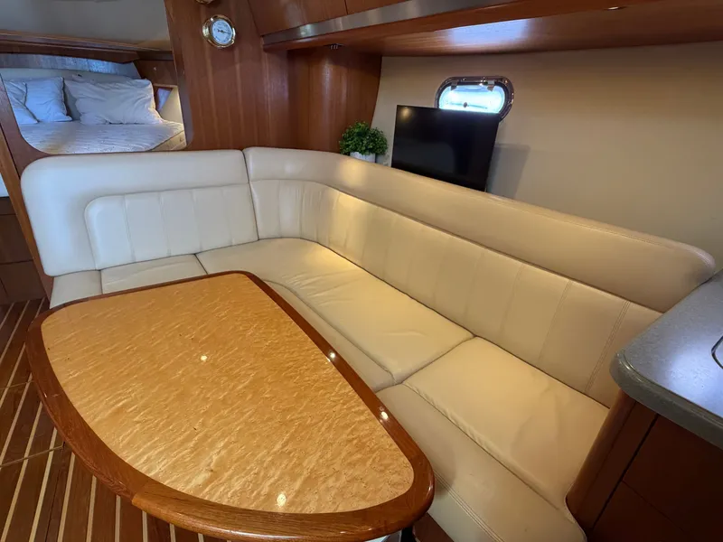 Slide: The Image of Interior of 2006 Tiara Yachts 3600 Sovran with cozy seating and elegant wood finishes. - 24