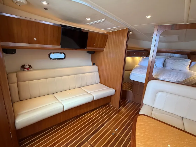 Slide: The Image of Luxurious interior of 2006 Tiara Yachts 3600 Sovran with wood finishes and modern amenities. - 25