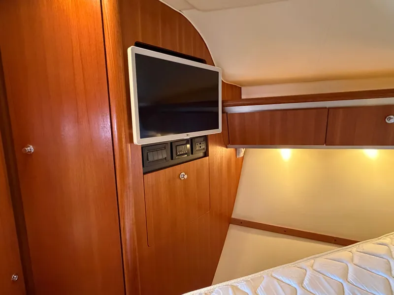 Slide: The Image of Open refrigerator in 2006 Tiara Yachts 3600 Sovran, showcasing interior shelves and storage. - 29
