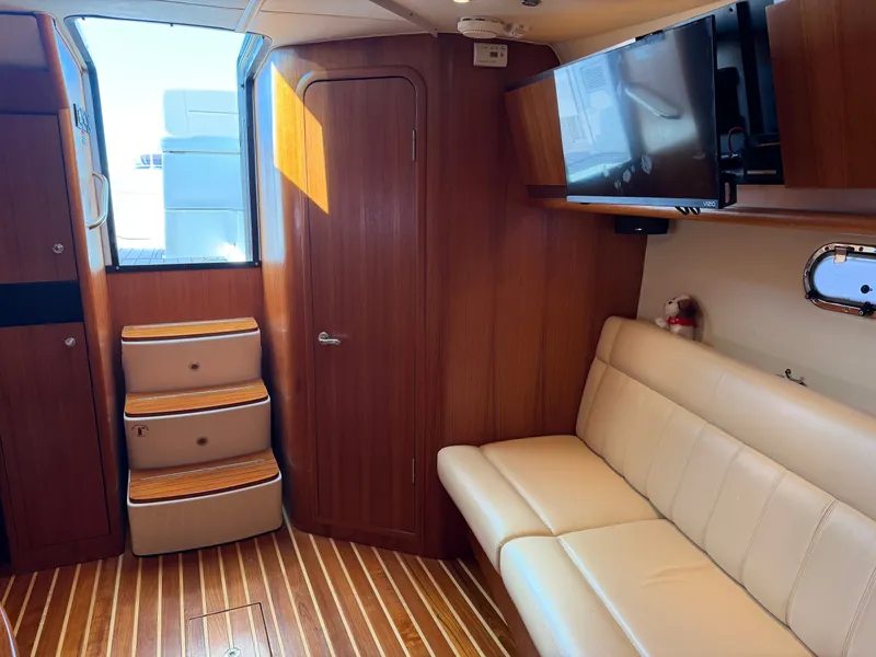 Slide: The Image of Luxurious interior of 2006 Tiara Yachts 3600 Sovran with cozy seating and nautical decor. - 30