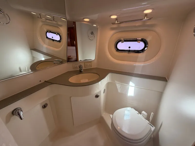 Slide: The Image of Interior of 2006 Tiara Yachts 3600 Sovran with cream sofa and nautical-themed pillows. - 31