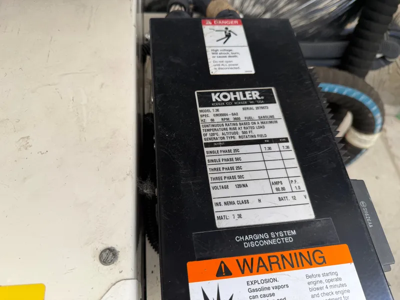 Slide: The Image of 2006 Tiara Yachts 3600 Sovran interior with wood paneling and cozy seating area. - 38