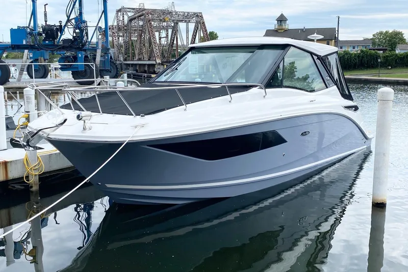 Slide: The Image of Interior of 2021 Sea Ray Sundancer 320 Coupe with luxurious seating and modern design. - 11