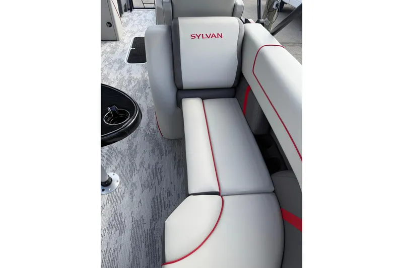Slide: The Image of 2026 Sylvan X-3 LZ DH boat interior with gray seating and red accents. - 10
