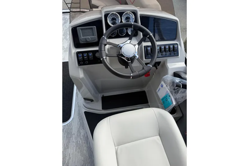 Slide: The Image of 2026 Sylvan X-3 LZ DH boat dashboard with steering wheel and control panel. - 11