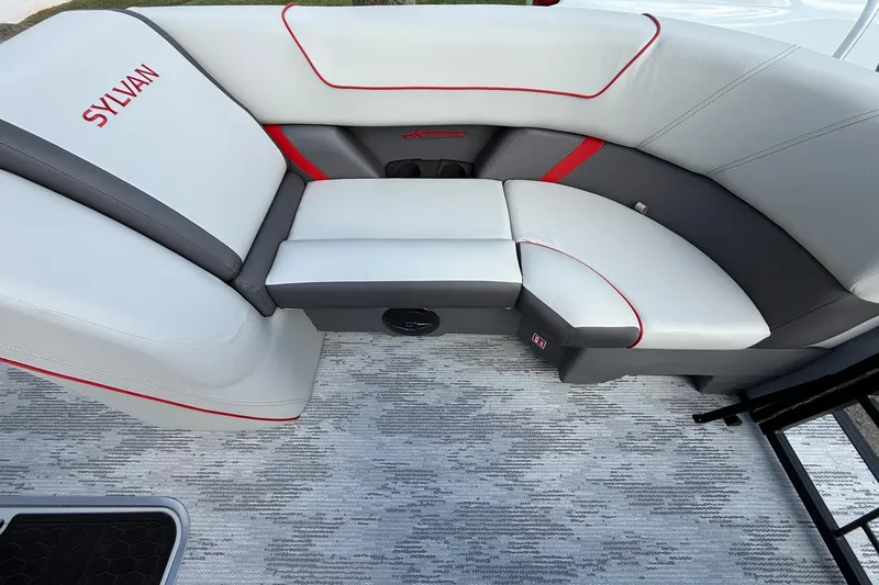 Slide: The Image of Luxurious seating in 2026 Sylvan X-3 LZ DH boat with modern design and red accents. - 16