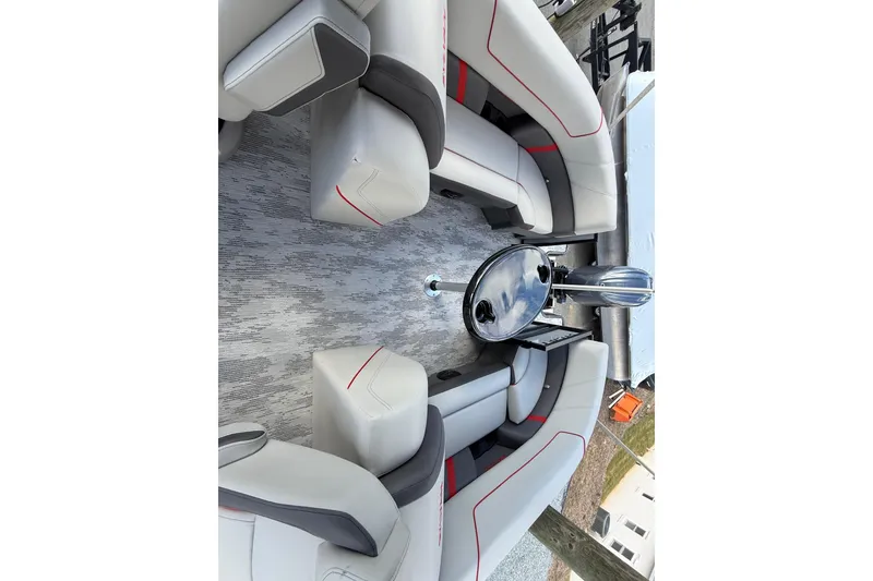 Slide: The Image of Luxurious interior of 2026 Sylvan X-3 LZ DH pontoon boat with plush seating and sleek table. - 18