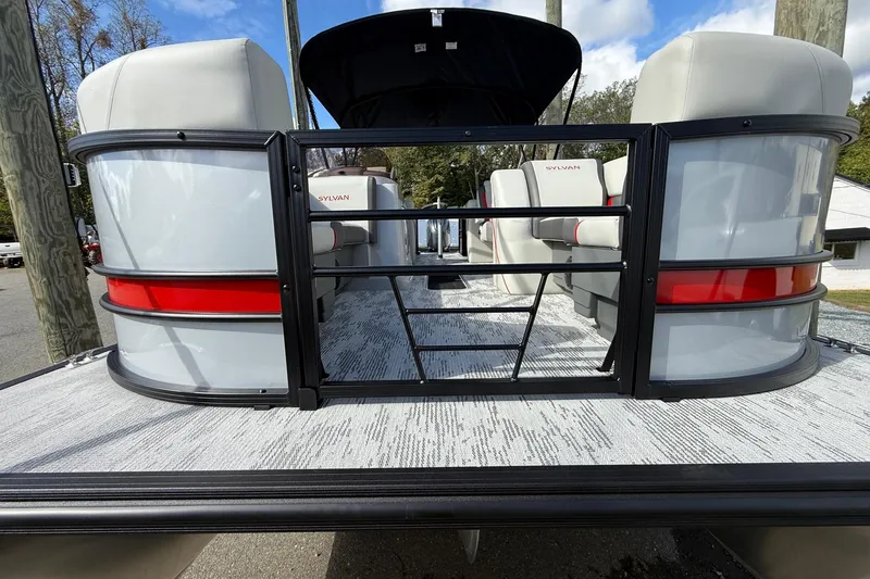 Slide: The Image of 2026 Sylvan X-3 LZ DH pontoon boat with sleek design and comfortable seating. - 23