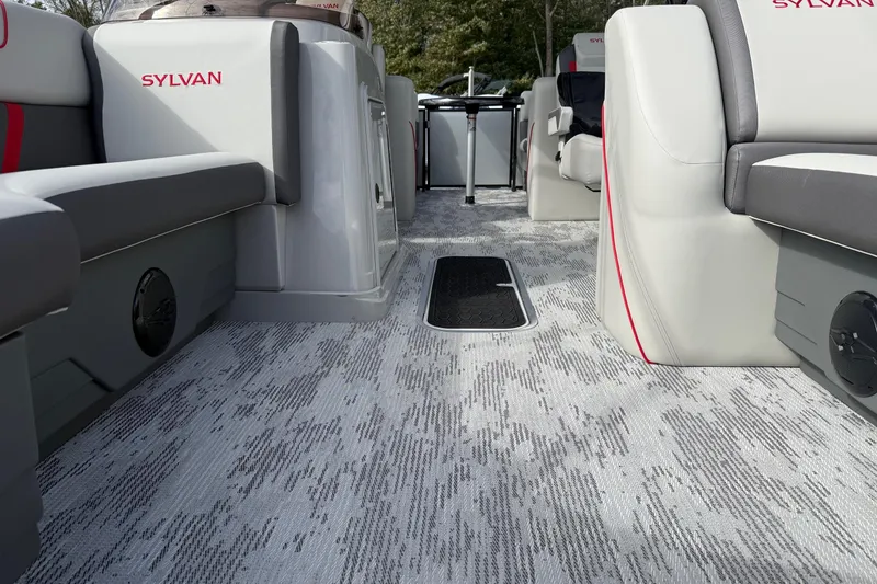 Slide: The Image of Interior view of 2026 Sylvan X-3 LZ DH boat with modern seating and flooring. - 6
