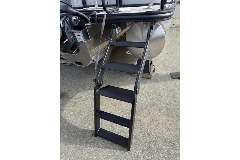 Slide: The Image of Four-step black ladder on a 2026 Sylvan X-3 LZ DH boat. - 7