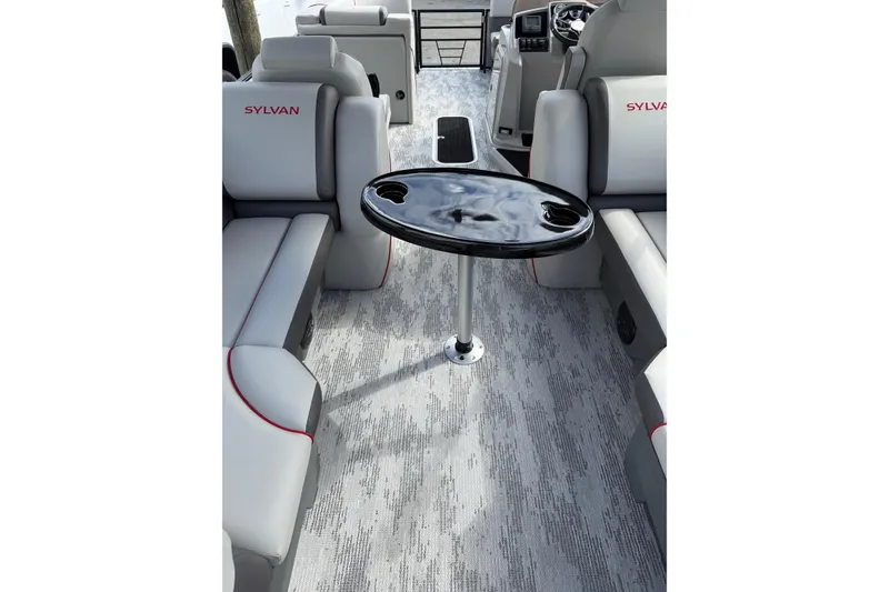 Slide: The Image of Interior of 2026 Sylvan X-3 LZ DH boat with modern seating and table. - 9