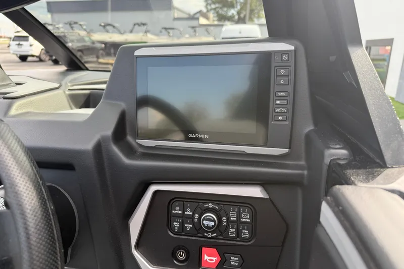 Slide: The Image of 2022 Axis A24 dashboard featuring Garmin display and control panel. - 15